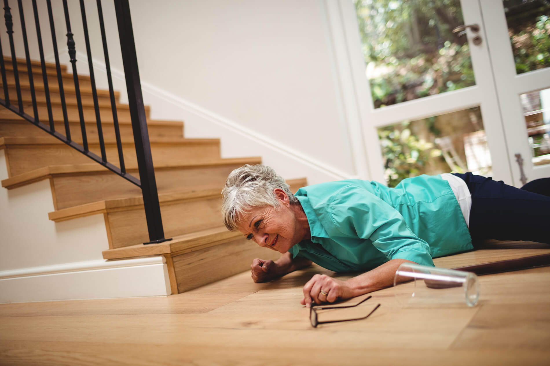 Senior losing balance while descending stairs at home
